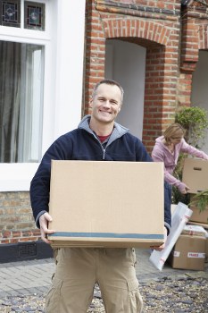 Man with a van loading household items in Kingston
