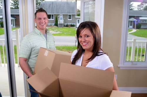 Charity donation boxes and reusable household items prepared after a move