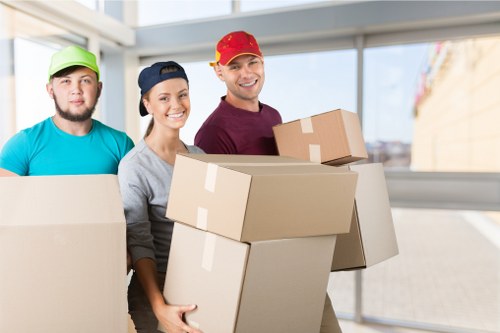 Professional movers handling household furniture during a Kingston relocation