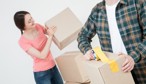 Packed boxes and furniture prepared for transport in Kingston