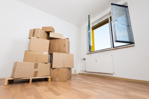 A local removals team handling stairs and tight access in a Kingston property