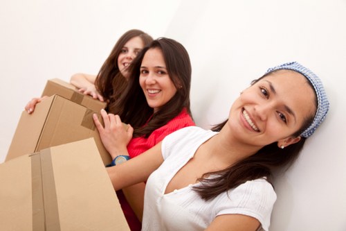 Packed household boxes being loaded for removal truck hire