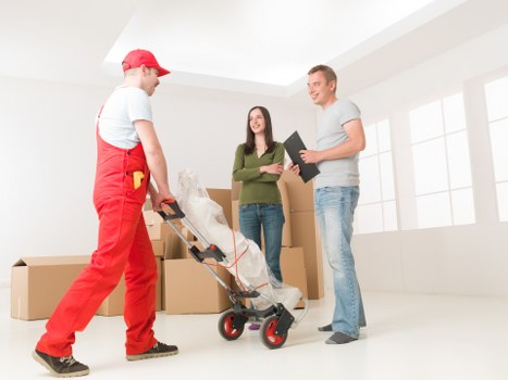 Moving staff using PPE and safe lifting techniques