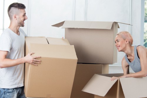 Packed boxes and furniture ready for flat removals in Kingston