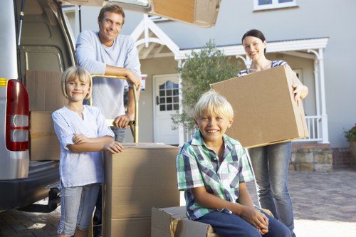 Careful loading of items into a van in Kingston